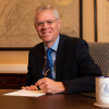 W&L President Will Dudley sitting at his desk.